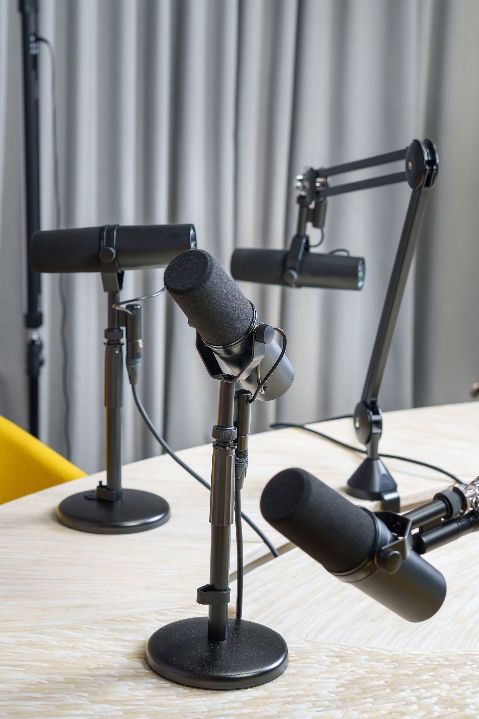 Podcast microphones on a desk
